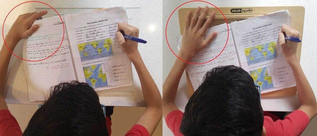 Correct hand position using a writing slope